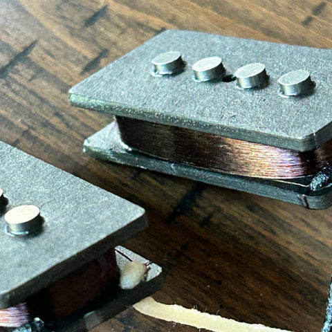 P-Bass Pickups On Wooden Table