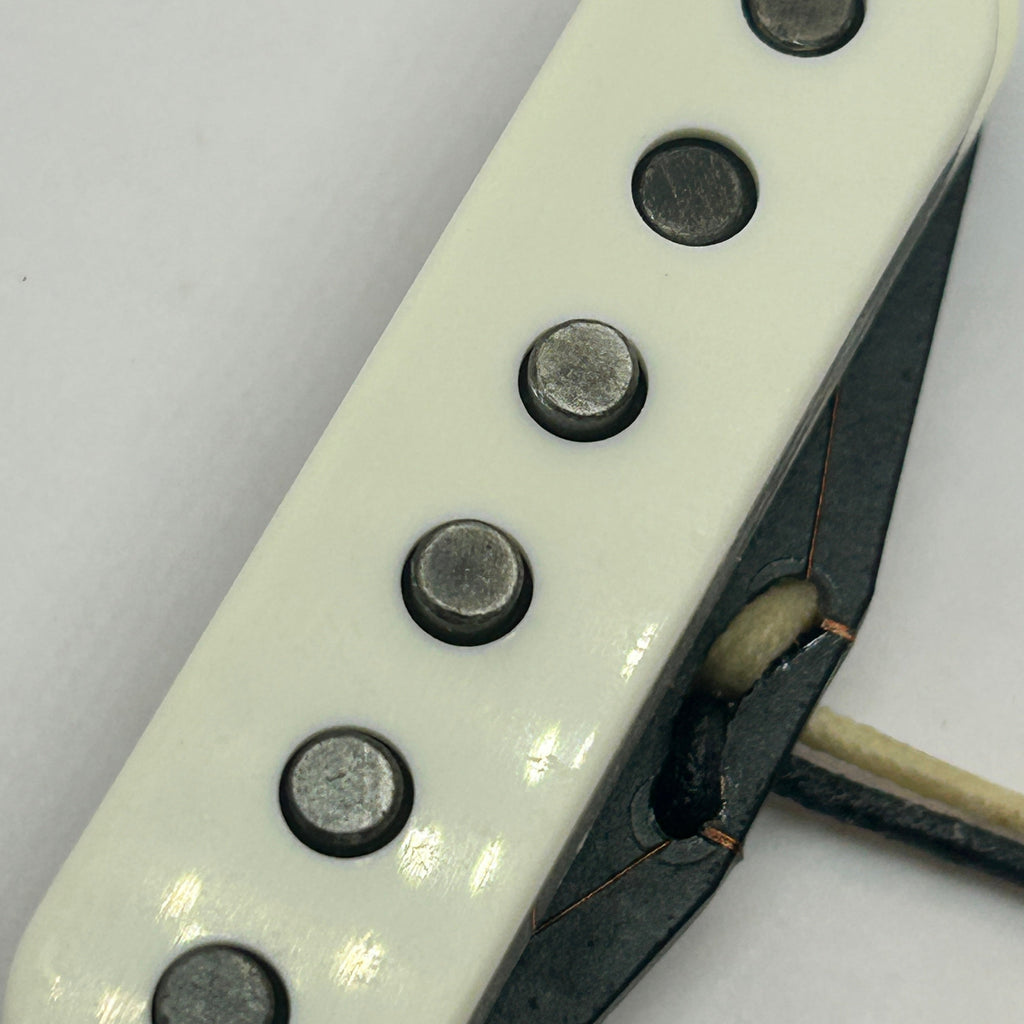Close-up of Brickhouse Toneworks '63 Strat pickup - oxidized alnico poles, aged cover