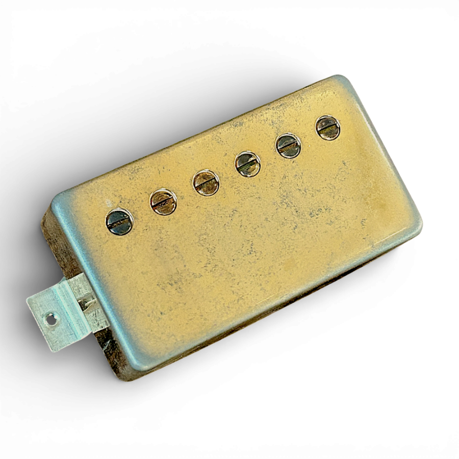 Aged 1960-spec PAF humbucker pickup with heavily patinated gold cover and slotted adjustment screws